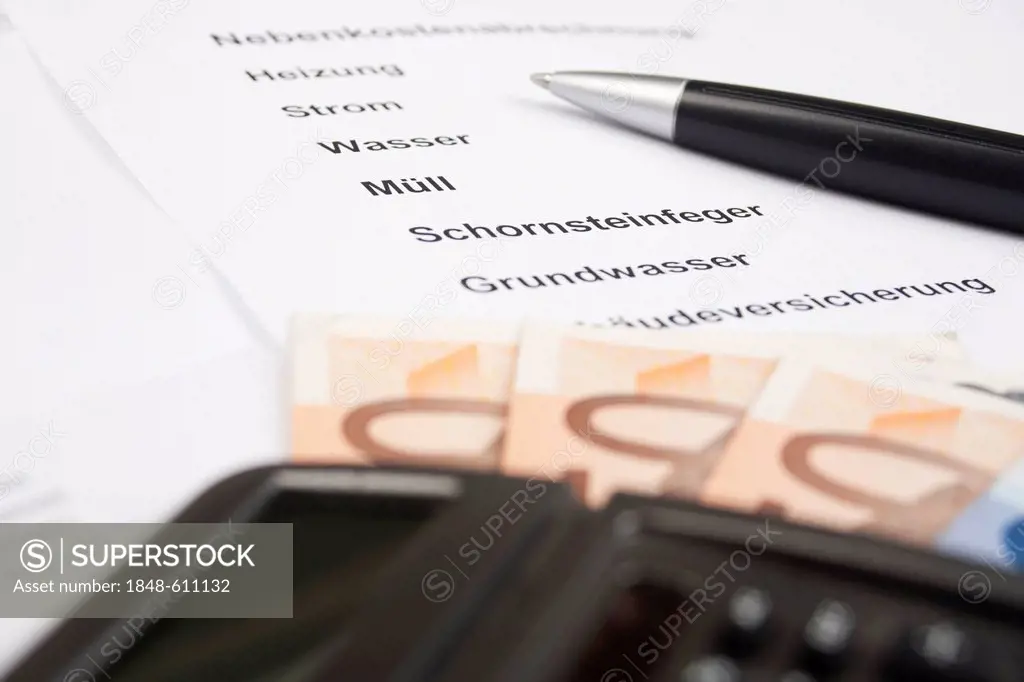Utilities statement with a pen and a calculator, in German