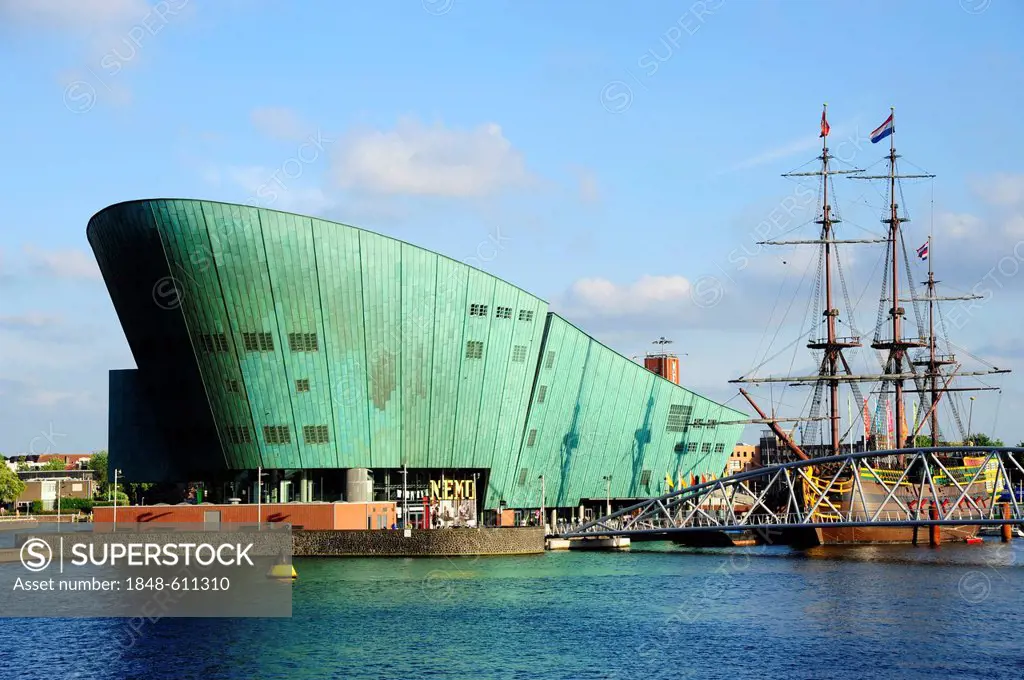 NEMO Science and Technology Center on Oosterdok wharf, replica of a sailing ship of the maritime museum, Scheepvaart Museum, Amsterdam, North Holland,...