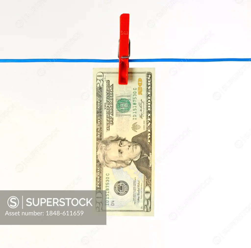 U.S. dollar bank note on a clothesline, symbolic image for money laundering, dirty money