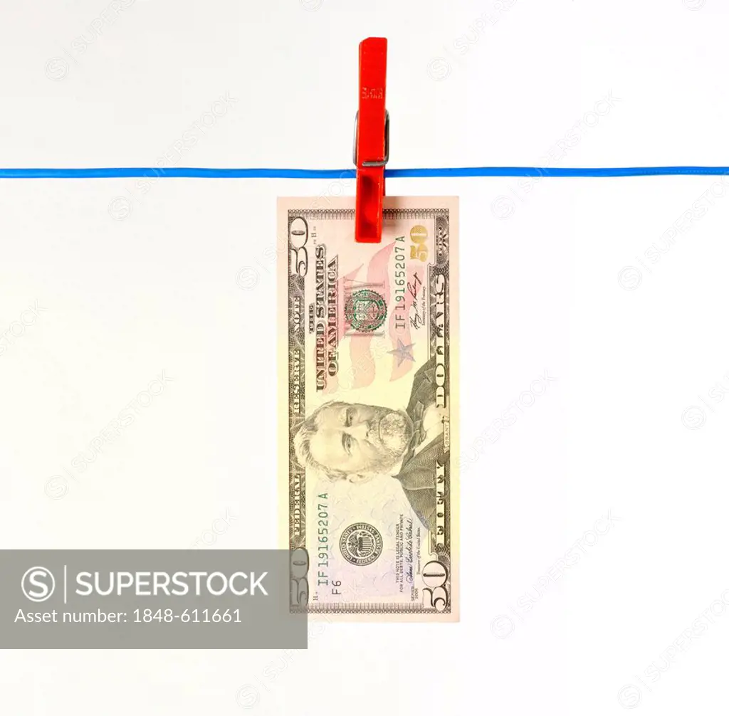 U.S. dollar bank note on a clothesline, symbolic image for money laundering, dirty money