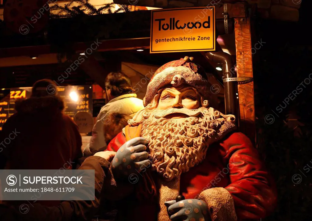 Tollwood winter festival, Santa Claus and a sign, GMO-free zone, Theresienwiese, Munich, Bavaria, Germany, Europe