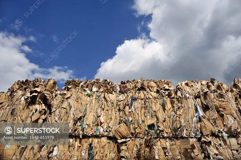 Pressed and stacked waste paper behind the wall of a recycling company, Bamberg, Upper Franconia, Bavaria, Germany, Europe