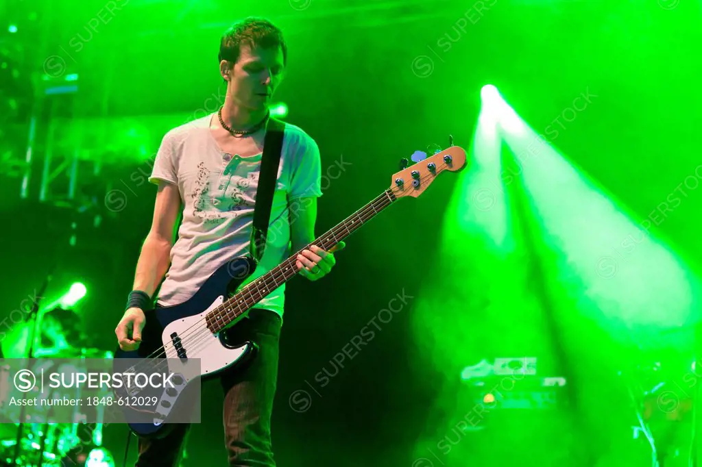 Florian Senn, bass guitarist of the Swiss pop band Lovebugs playing live at the Soundcheck Open Air in Sempach-Neuenkirch, Lucerne, Switzerland, Europ...