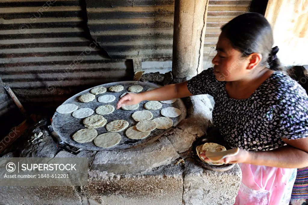 Tortillas being made in a kitchen, Lomas de Santa Faz slum, Guatemala City, Guatemala, Central America