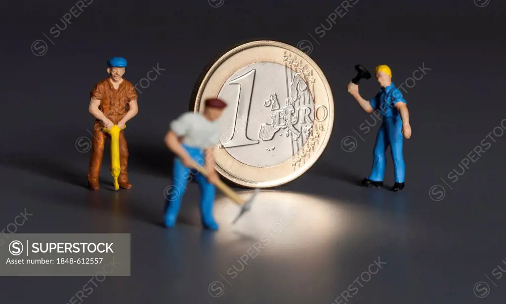 1 euro coin with miniature worker figures, symbolic image for the labor market, one-euro jobs, debt, wages, pensions