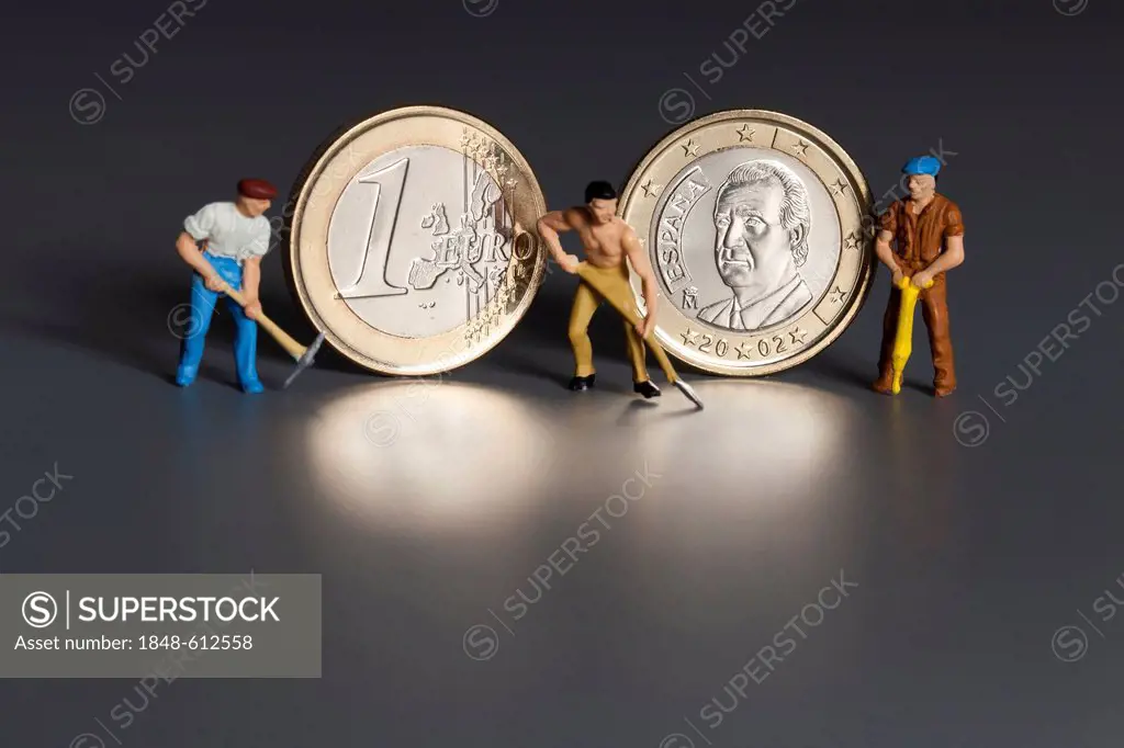 Spanish 1 euro coins with miniature worker figures, symbolic image for the labor market, one-euro jobs, debt, wages, pensions