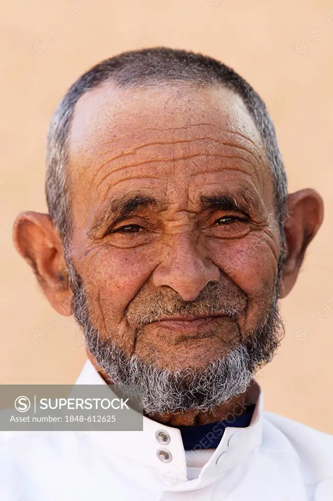 Portrait of a the owner of part of an oasis where Damask Roses (Rosa damascena) are organically grown, Valley of Roses, Dades Valley, southern Morocco...