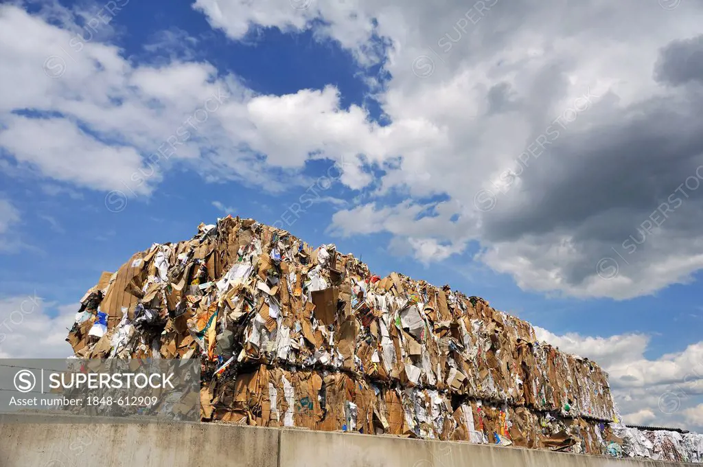 Pressed and stacked waste paper behind the wall of a recycling company, Bamberg, Upper Franconia, Bavaria, Germany, Europe