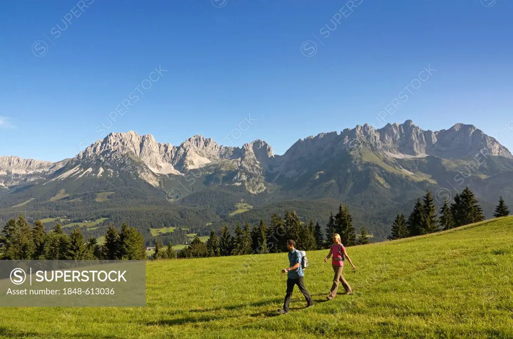 Hikers on a local mountain, Mt Hartkaiser, with views of Wilder Kaiser massif, Tyrol, Austria, Europe