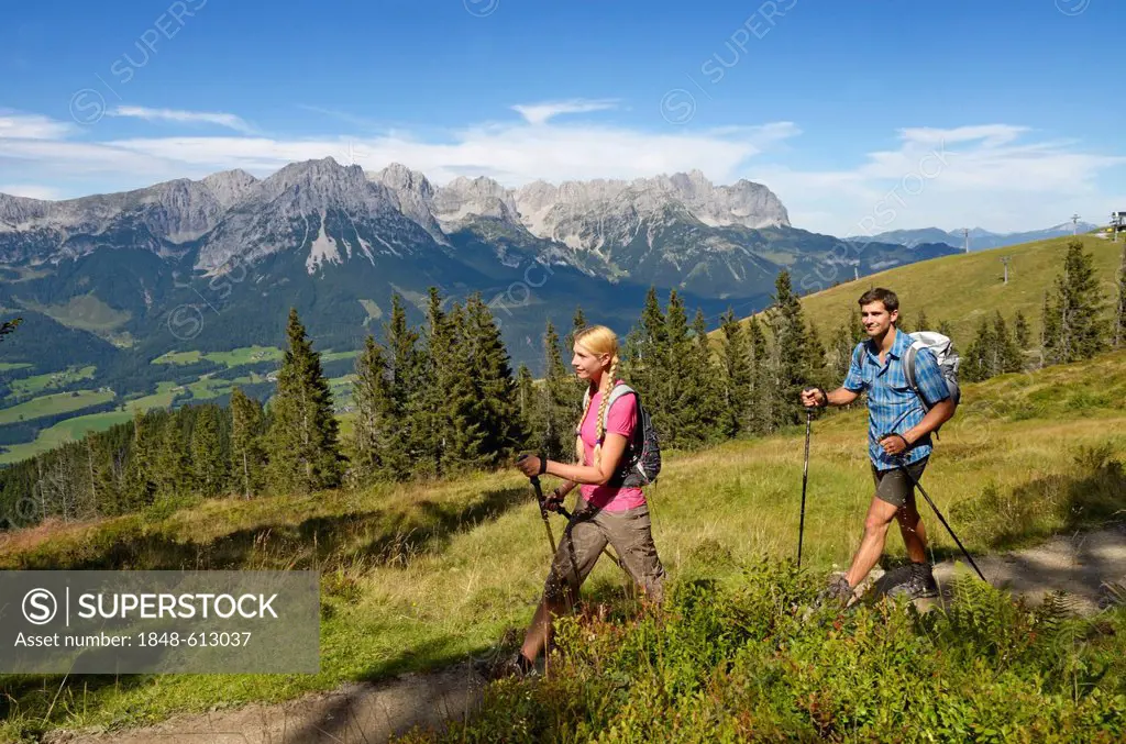 Hikers at Mt Hartkaiser with views of Wilder Kaiser massif, Tyrol, Austria, Europe