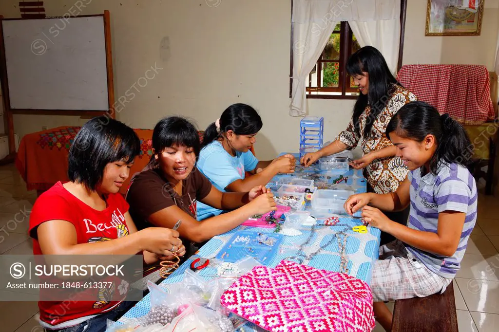 Young women making jewelry, vocational training center, Siantar, Sumatra, Indonesia, Asia