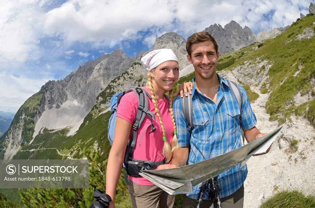 Hikers ascending from Gruttenhuette hut to Mt Ellmauer Halt, Wilder Kaiser massif, Tyrol, Austria, Europe