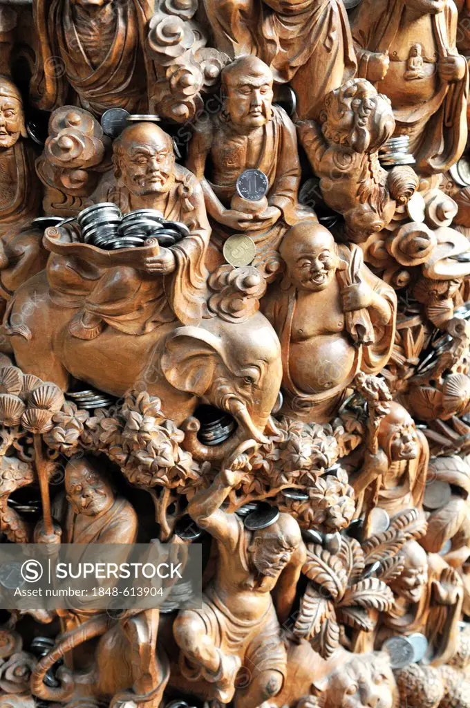 Carved Buddha sculptures with donated money, Jade Buddha Temple, Shanghai, China, Asia
