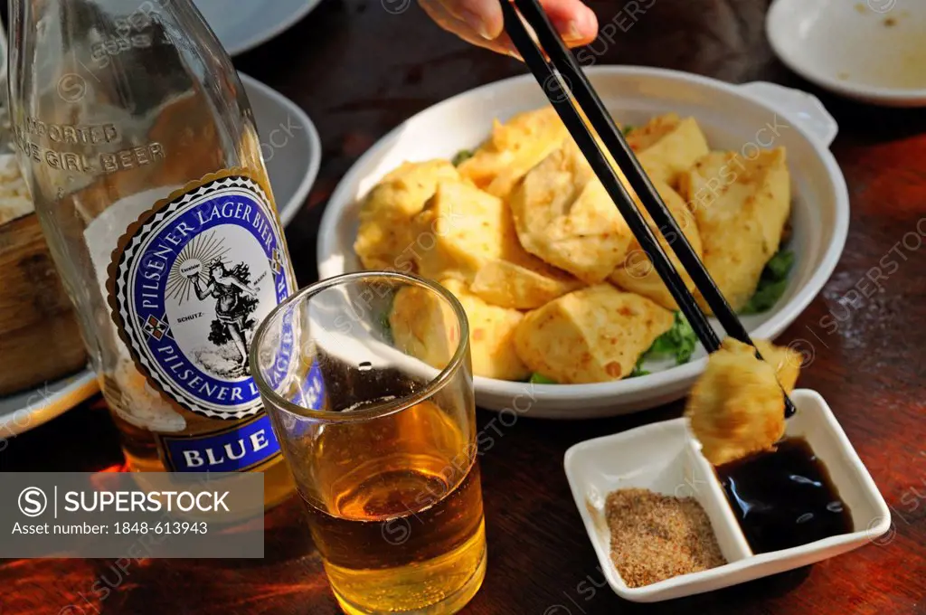 Blue Girl beer with fish at the restaurant of the Tai O Fishing Village, Lantau Island, Hong Kong, China, Asia