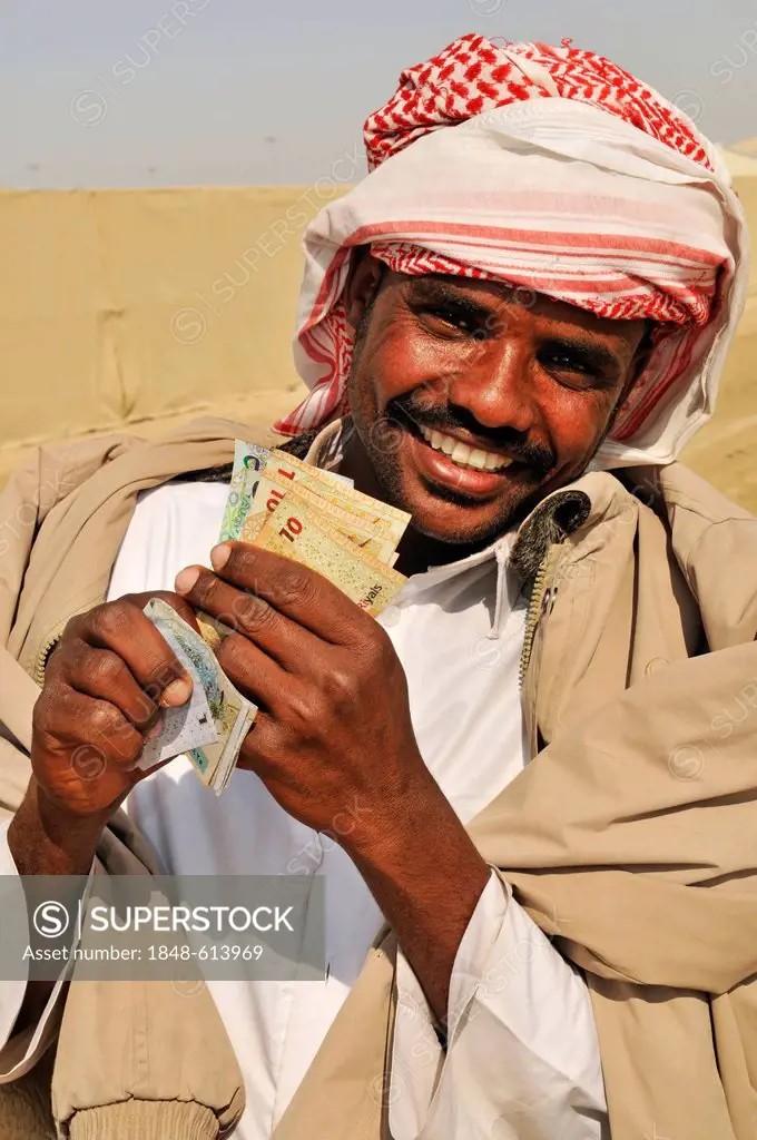 Camel driver with stakes, Al Sheehaniya, camel racing track, Doha, Qatar, Middle East