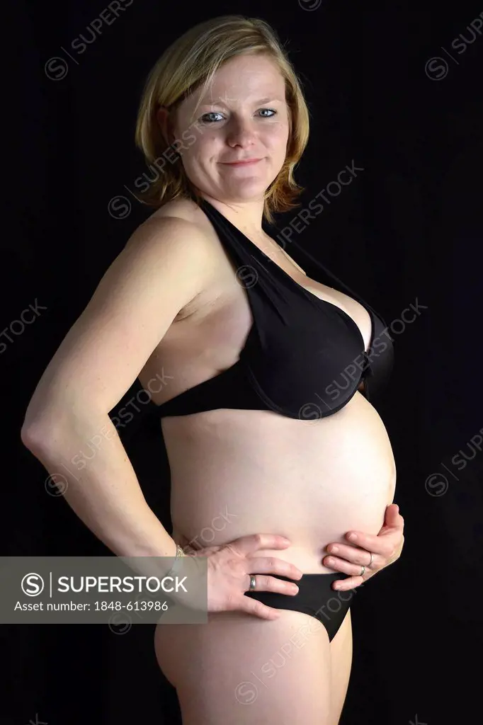 Pregnant woman in underwear