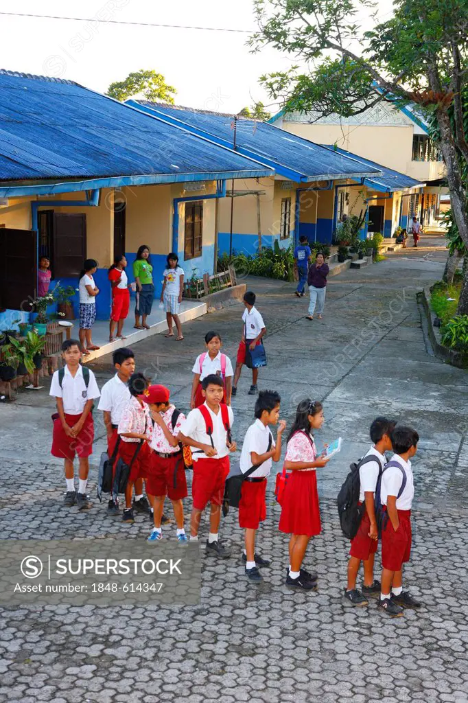 Children in school uniform in the yard, Gelora Kasih orphanage, Kabanjahe, Batak region, Sumatra, Indonesia, Southeast Asia, Asia