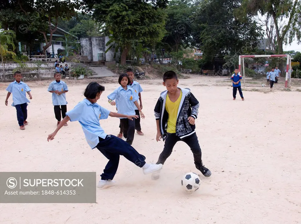 Children playing soccer, Koh Samet, Thailand, Asia