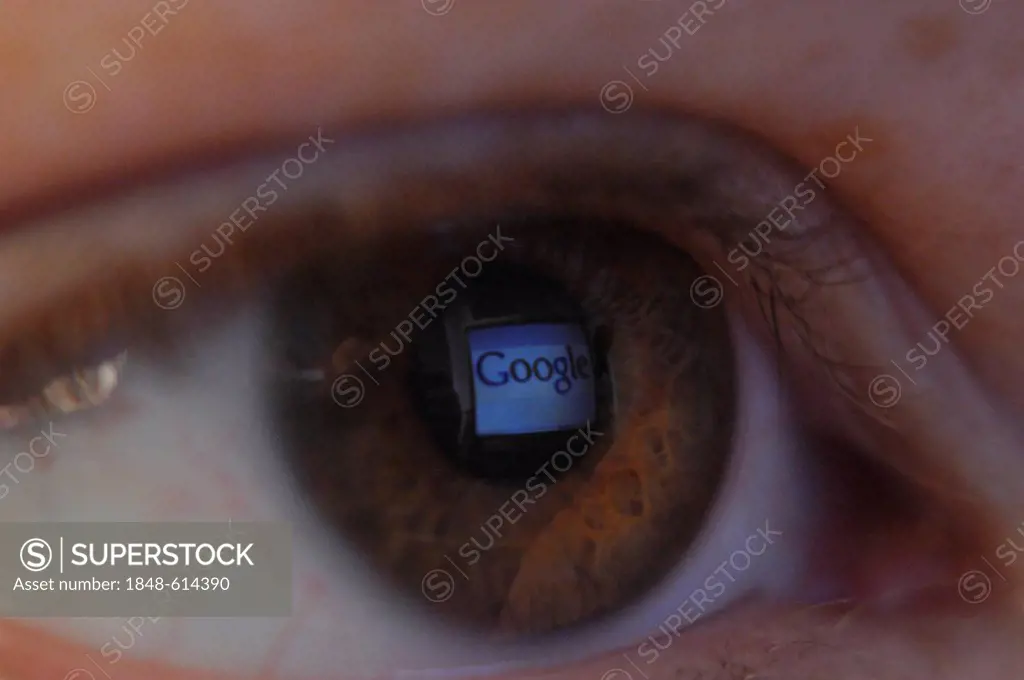 Close-up of an eye with a reflection of the Google webpage