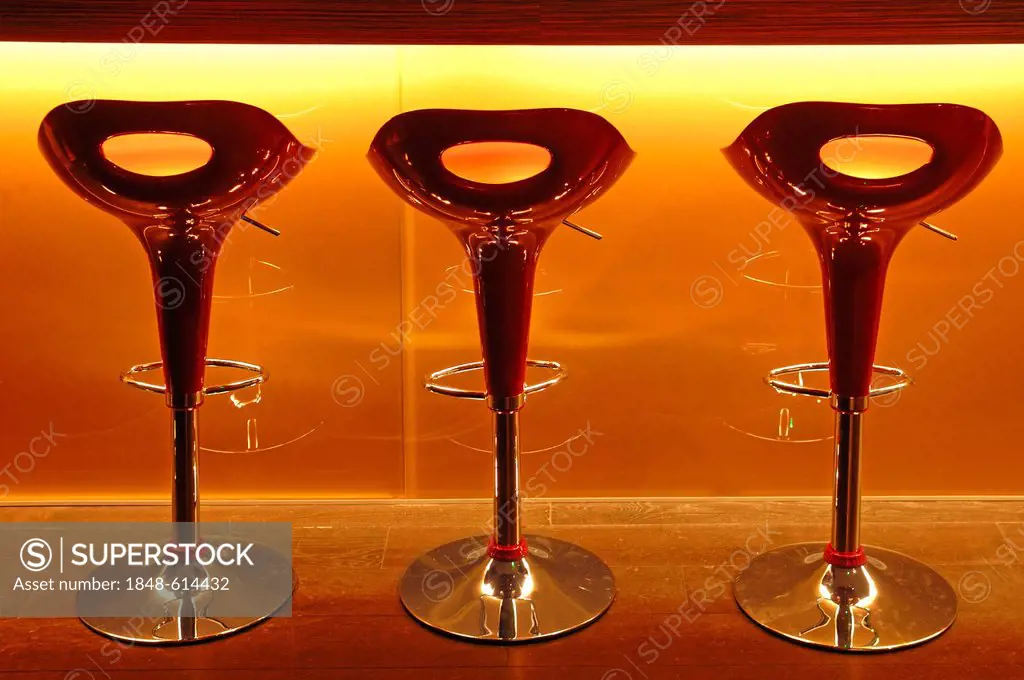 Three red plastic bar stools in front of a bar at a school of hotel management, Lycee Economique et Hôtelier Joseph Storck, Rue du Chemin Noir street,...