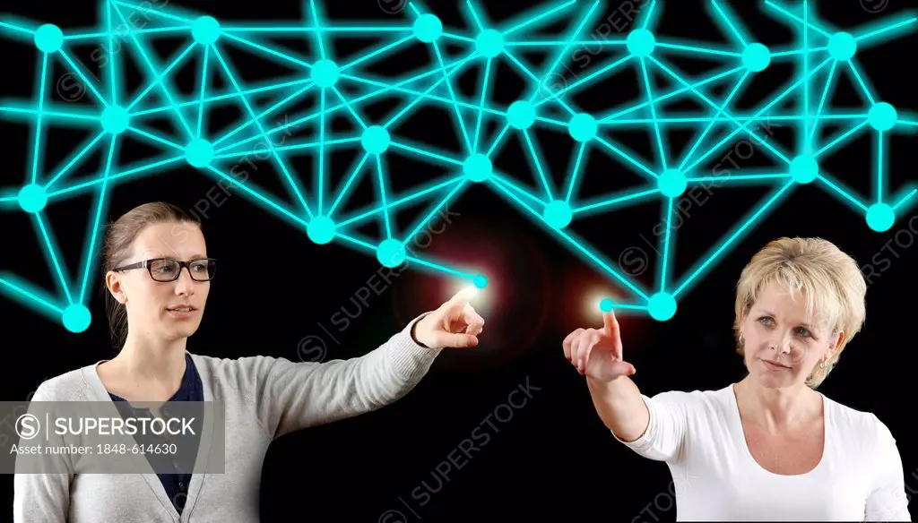 Two woman with a virtual model, symbolic image for networks, networking