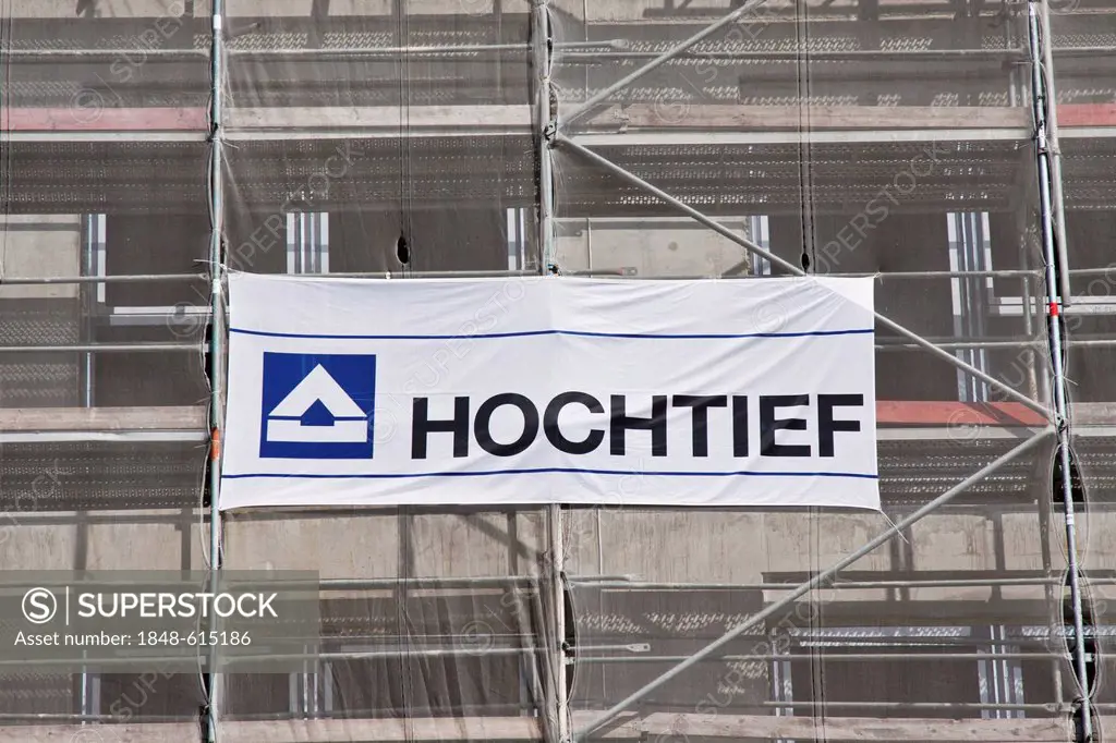Hochtief AG, logo of the construction company on a banner on the scaffolding of a construction site, Germany, Europe