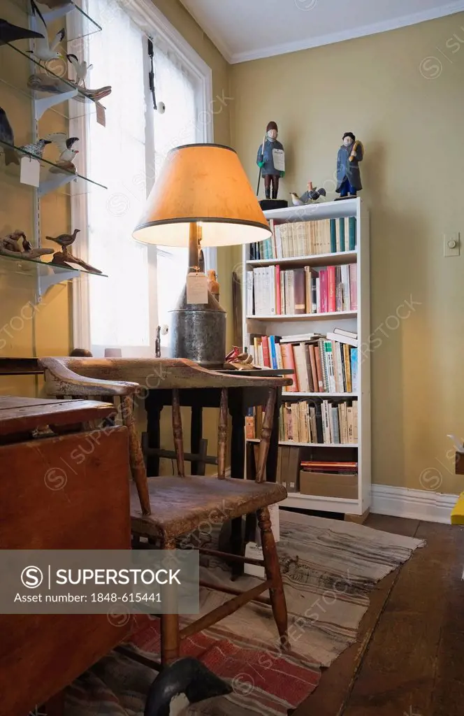 Antique wooden furniture and furnishings inside an old residential home/ antique store, Lanaudiere, Quebec, Canada. This image is property released fo...