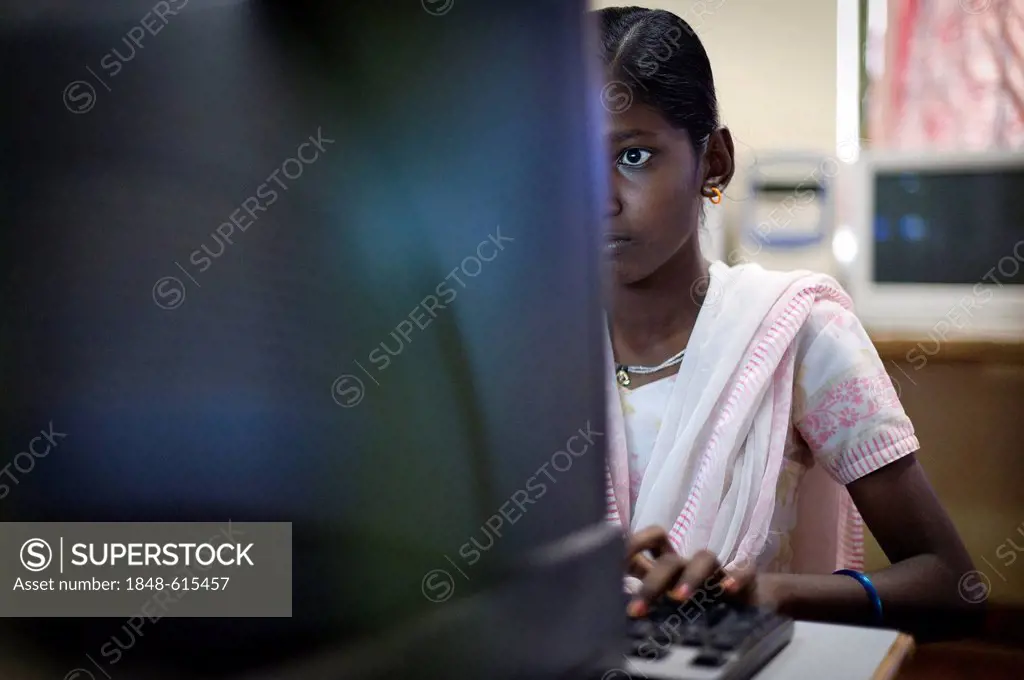 Indian girl getting a computer lesson, Kutties Rajiyam, Kids' World, centre for children, Karur, Tamil Nadu, South India, India, Asia