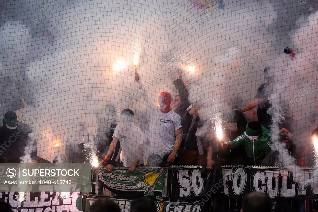 Fans of Borussia Moenchengladbach have ignited fireworks and flares during the match FSV Mainz 05 vs Borussia Moenchengladbach, Coface-Arena, Mainz, R...