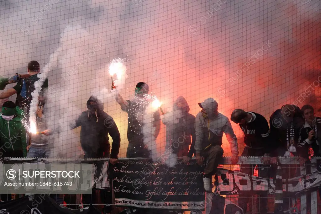 Fans of Borussia Moenchengladbach have ignited fireworks and flares during the match FSV Mainz 05 vs Borussia Moenchengladbach, Coface-Arena, Mainz, R...