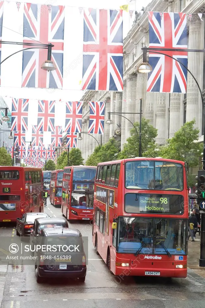 Traffic in the rain, double-decker buses on Oxford Street, Union Jack, national flag, London, England, United Kingdom, Europe