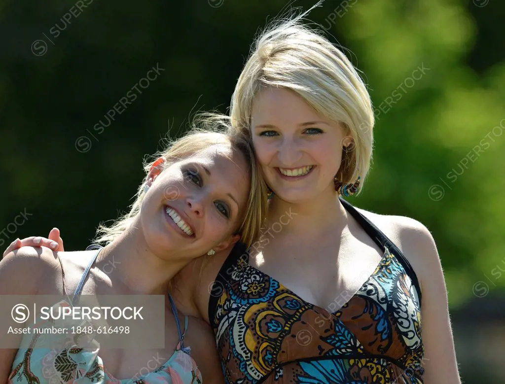 Young woman leaning on her friend, Stuttgart, Baden-Wuerttemberg, Germany, Europe, PublicGround