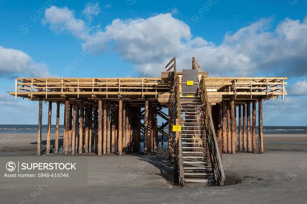 Construction site of a stilt house at low tide on the beach, North Sea, St. Peter-Ording, in Schleswig-Holstein, Germany, Europe