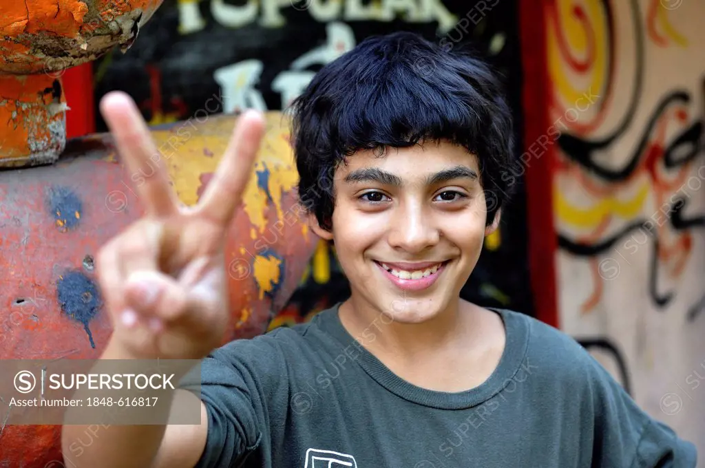Young person making the victory sign, Buenos Aires, Argentina, South America
