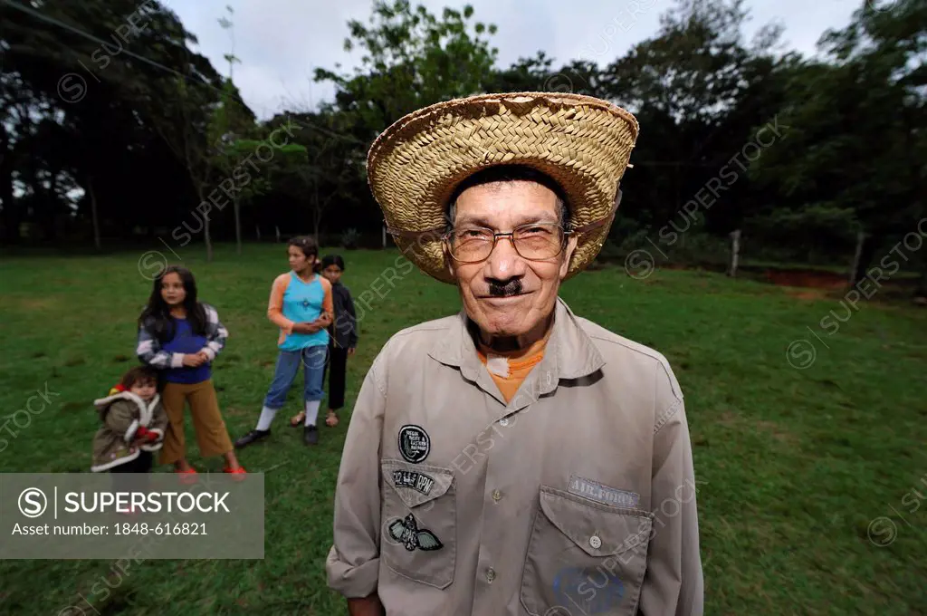 Old man with a straw hat and a moustache, Comunidad Kinta'i, Caaguazu, Paraguay, South America