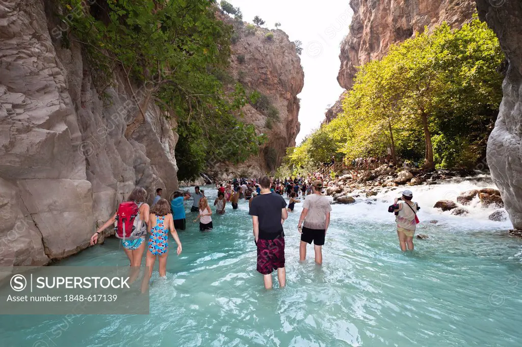 Tourists in the water of Saklikent Gorge near Tlos and Fethiye, Lycian coast, Lycia, Mediterranean, Turkey, Asia Minor