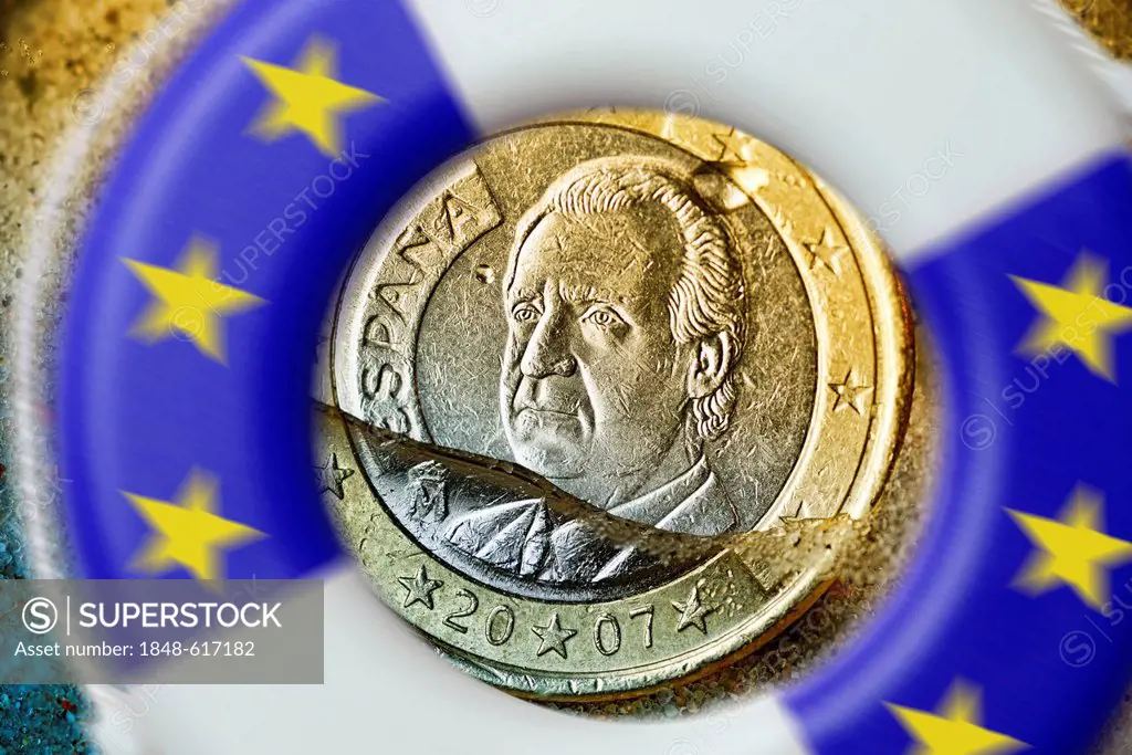 Spanish one-euro coin sinking into water, symbolic image for the debt crisis in Spain