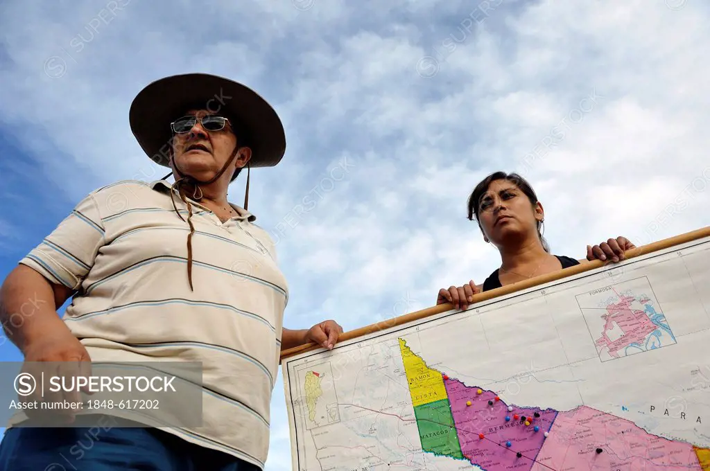 Environmental activists with a map of the floodplains of the Pilcomayo river, the area is being destroyed by a project supported by the Inter-American...