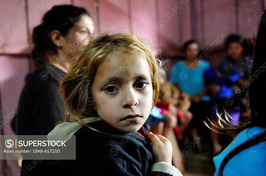 Girl during a meeting of an aid organisation that provides health services and information for mothers and children, portrait, Comunidad Martillo, Caa...