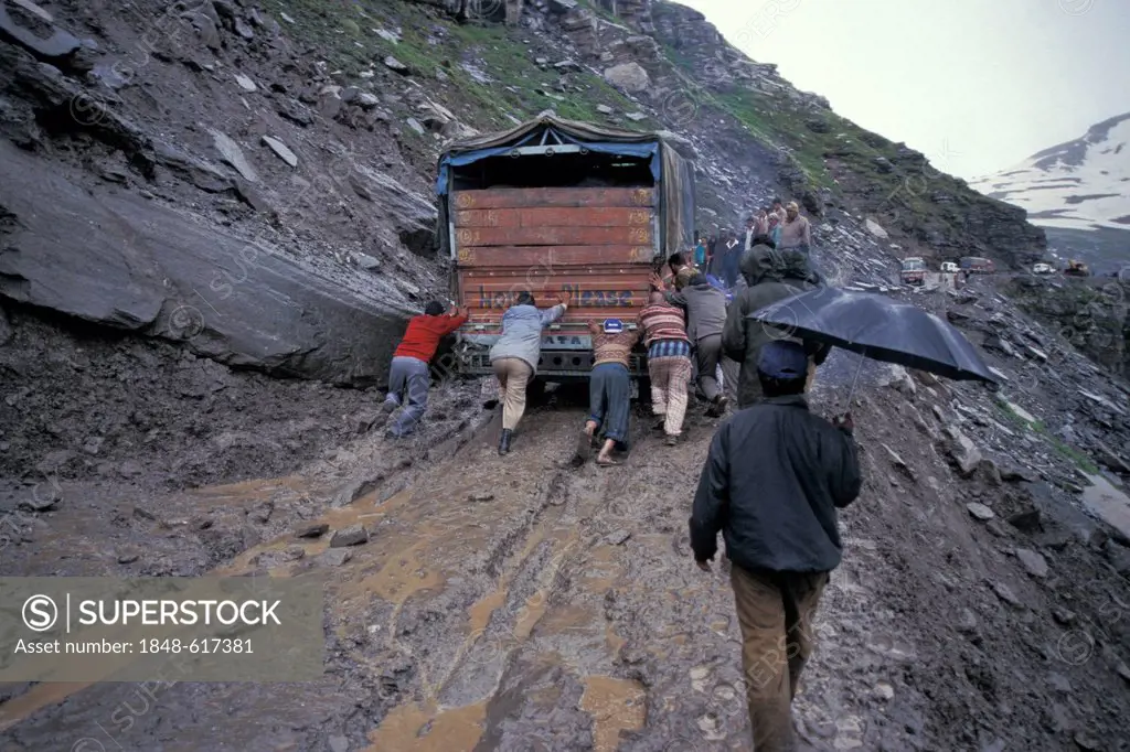 Truck is being pushed, watered down and road vulnerable to landslides, Rohtang Pass, Manali Leh Highway, Himachal Pradesh, Indian Himalayas, North Ind...