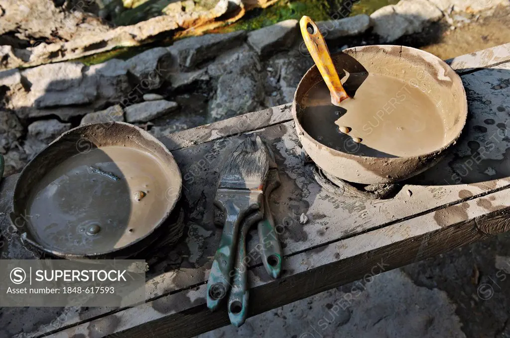 Healing mud in bowls with brushes near the hot springs, near the Hacienda Guachipelin, near Liberia, Guanacaste province, Costa Rica, Central America