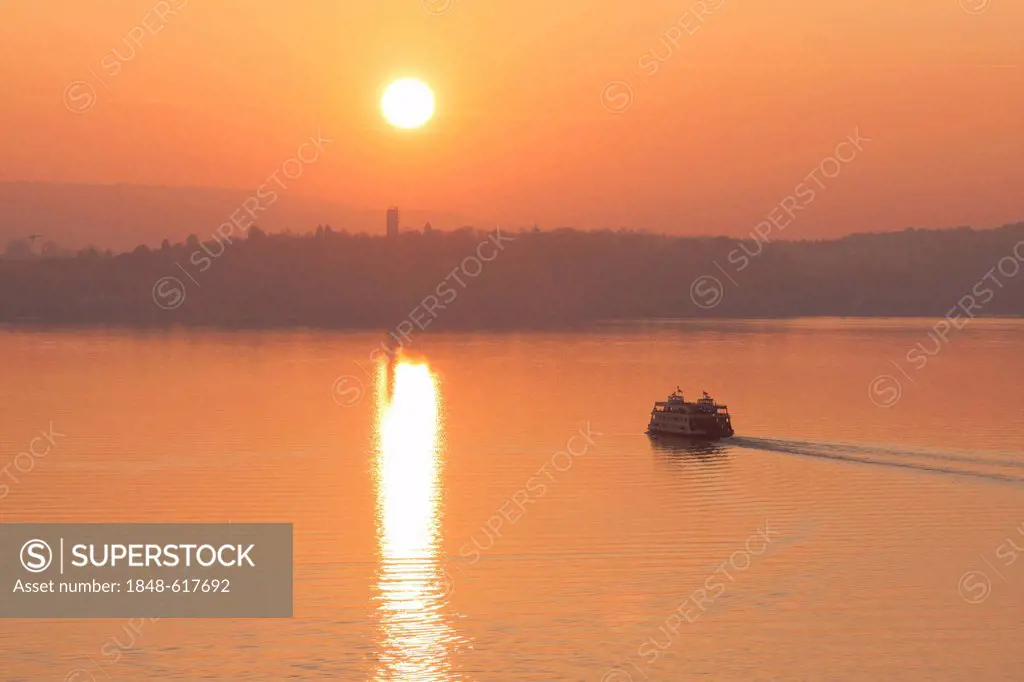 The ferry connecting Konstanz or Constance and Meersburg at sunset, view towards Konstanz, Baden-Wuerttemberg, Germany, Europe