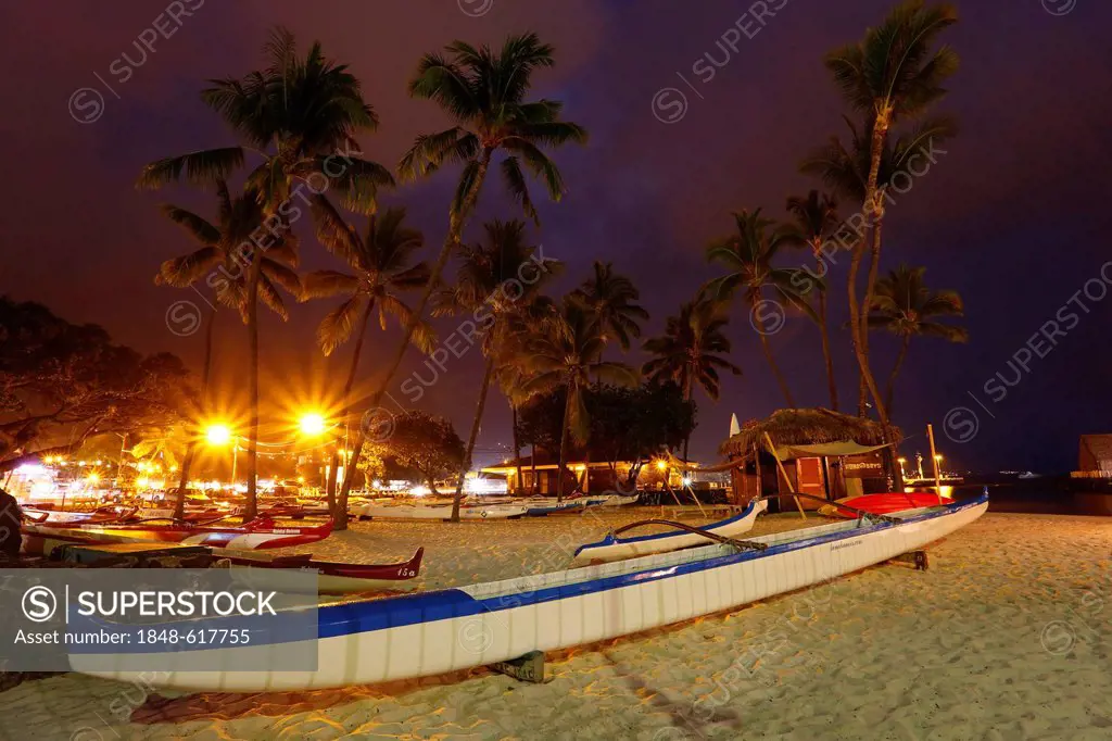 Outrigger canoes on the beach at night, Kona Beach, Kailua-Kona, Big Island, Hawaii, USA