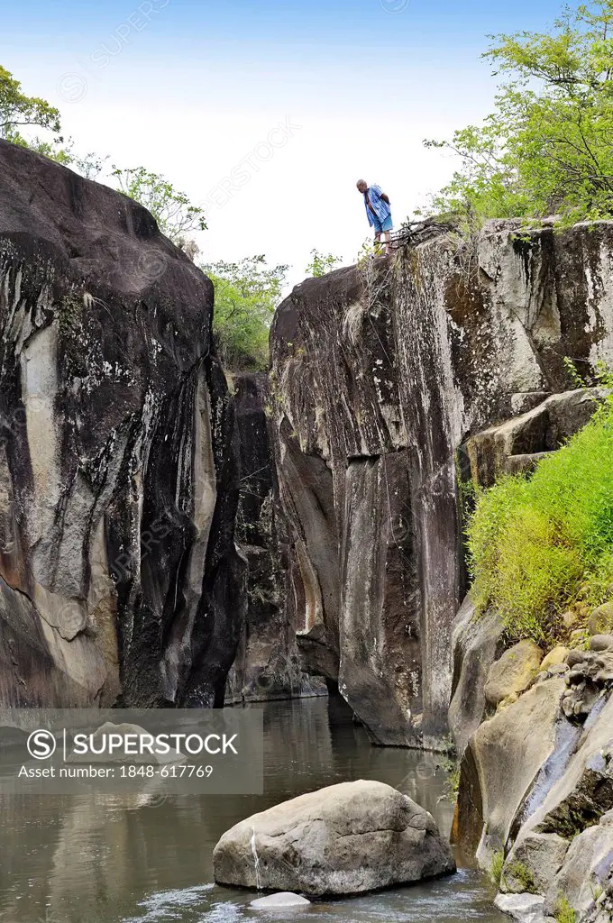 Tourists at a gorge with a river near Liberia, Guanacaste province, Costa Rica, Central America