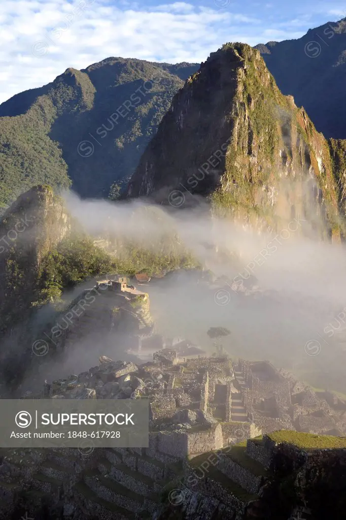 Inca ruins of Machu Picchu in the Andes, with fog, UNESCO World Heritage Site, Urubamba Valley, near Cusco, Cuzco, Peru, South America