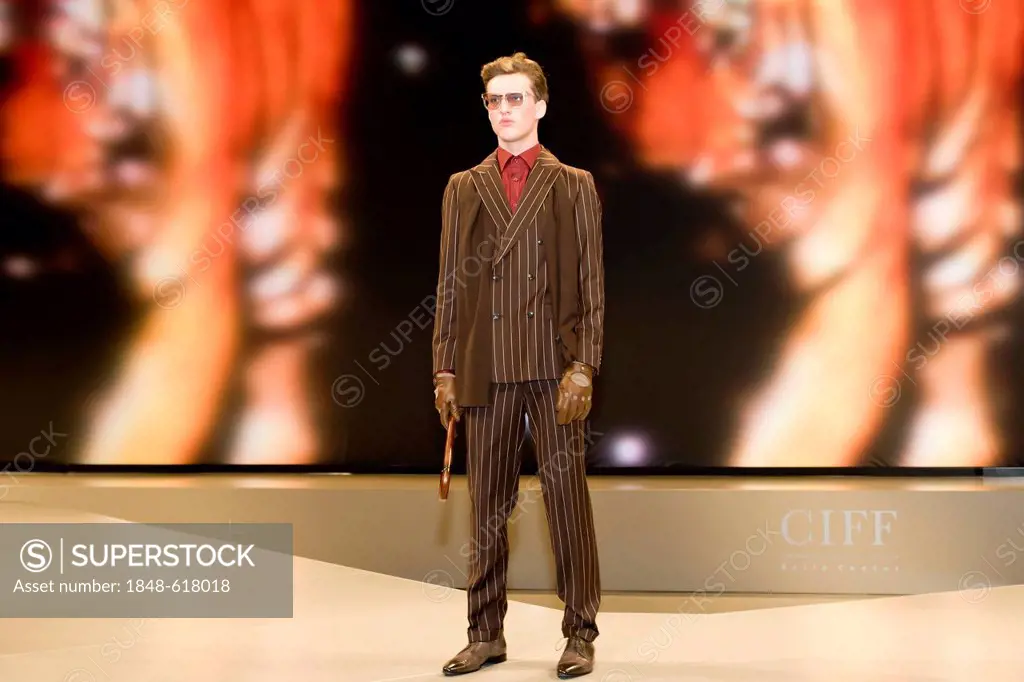 Young man presenting modern striped suit, Copenhagen International Fashion Fair, Copenhagen, Denmark, Europe