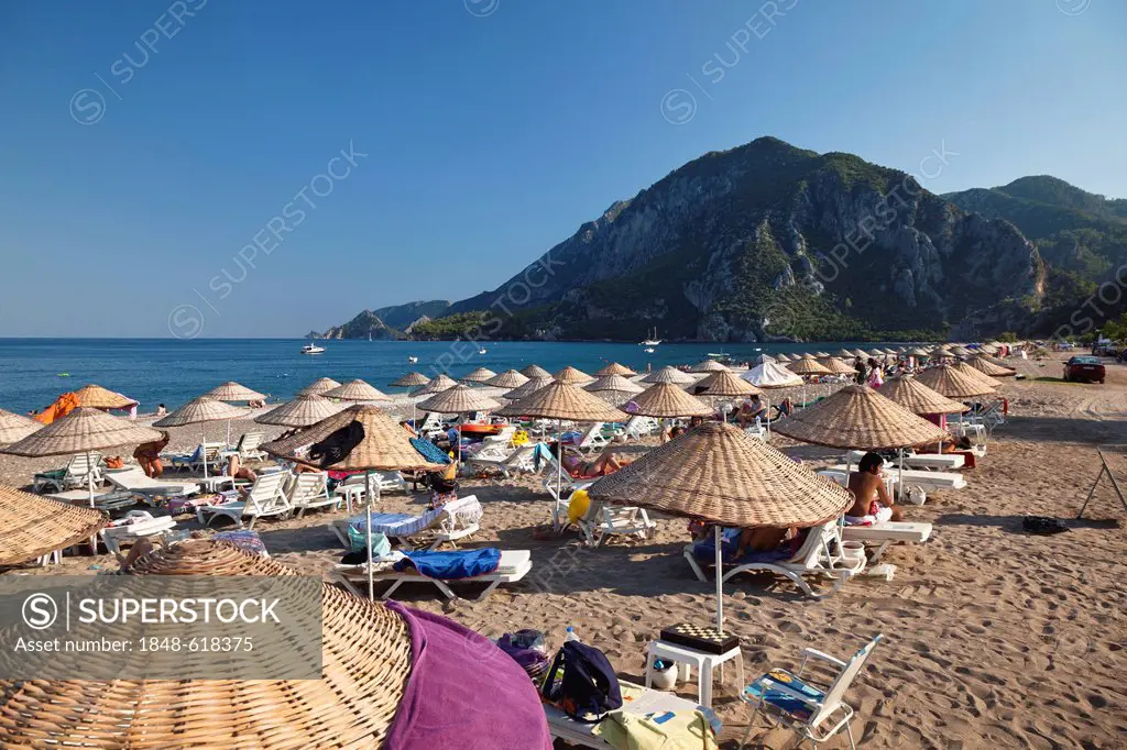 Sunshades and beach chairs on the beach of Cirali, Lycian coast, Lycia, the Aegean, Mediterranean Sea, Turkey, Asia Minor