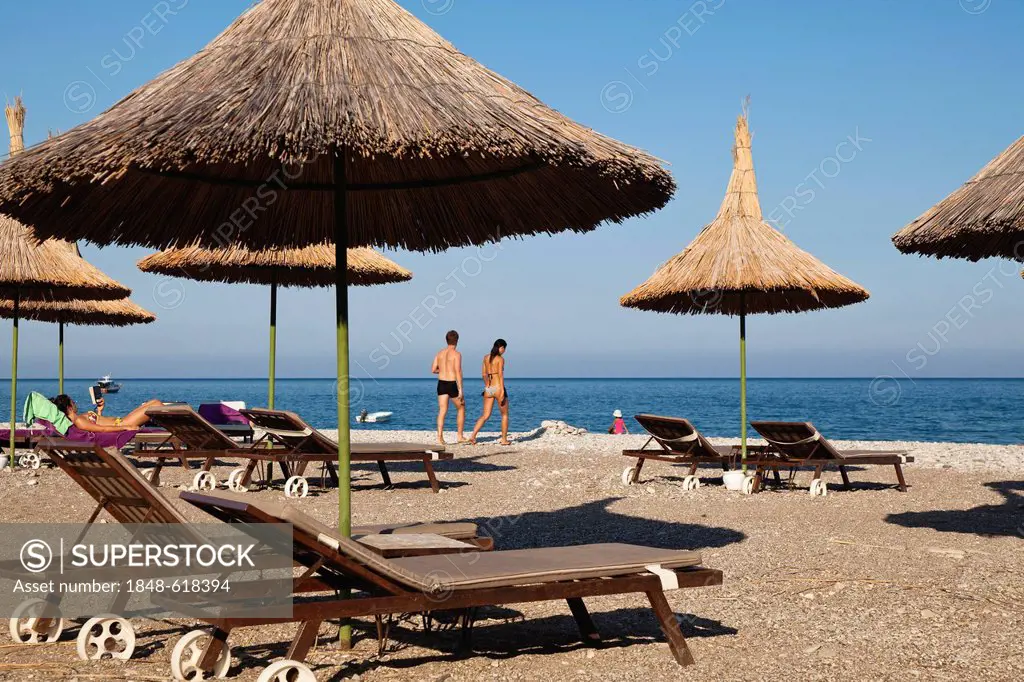 Beach chairs and sunshades on the beach of Olympos, Lycian coast, Lycia, Aegean, Mediterranean Sea, Turkey, Asia Minor