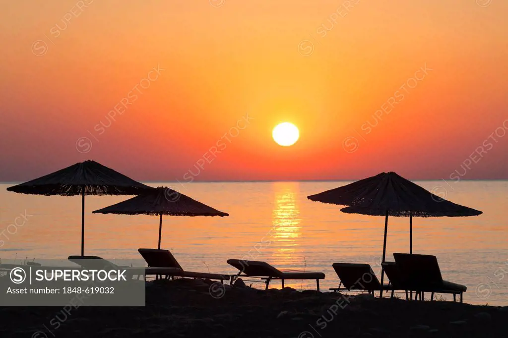 Beach chairs and sunshades on the beach at sunrise, Lycian coast, Lycia, the Aegean, Mediterranean Sea, Turkey, Asia Minor