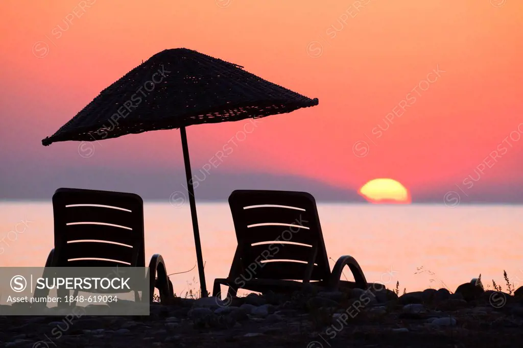 Beach chairs and sunshades on the beach at sunrise, Lycian coast, Lycia, the Aegean, Mediterranean Sea, Turkey, Asia Minor
